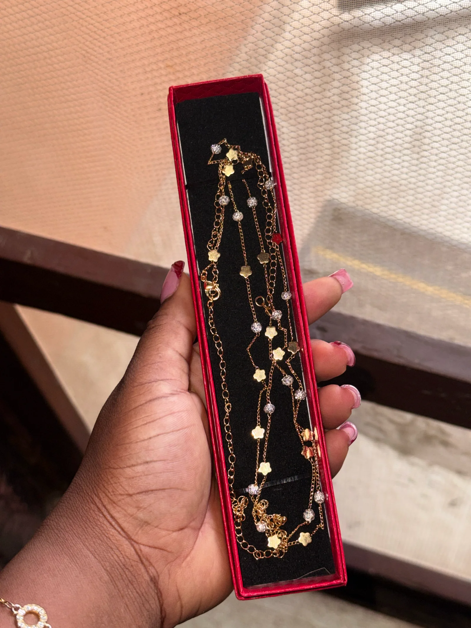 Gold-toned waist chain with flower and crystal details media 2