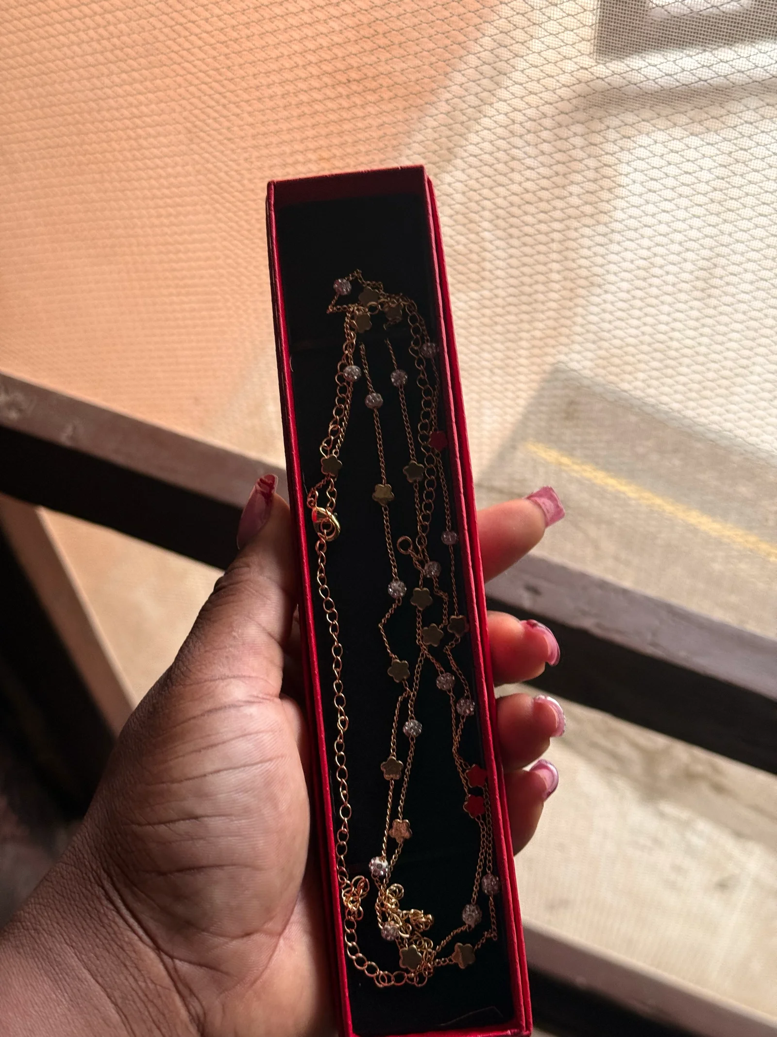 Gold-toned waist chain with flower and crystal details